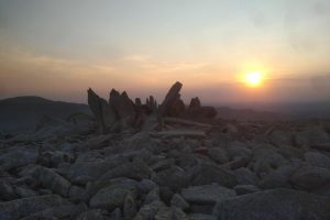 Image of sun rising over mountains